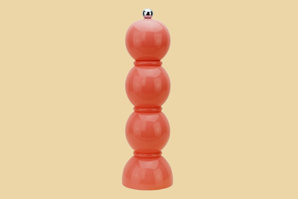 A red and silver pepper mill