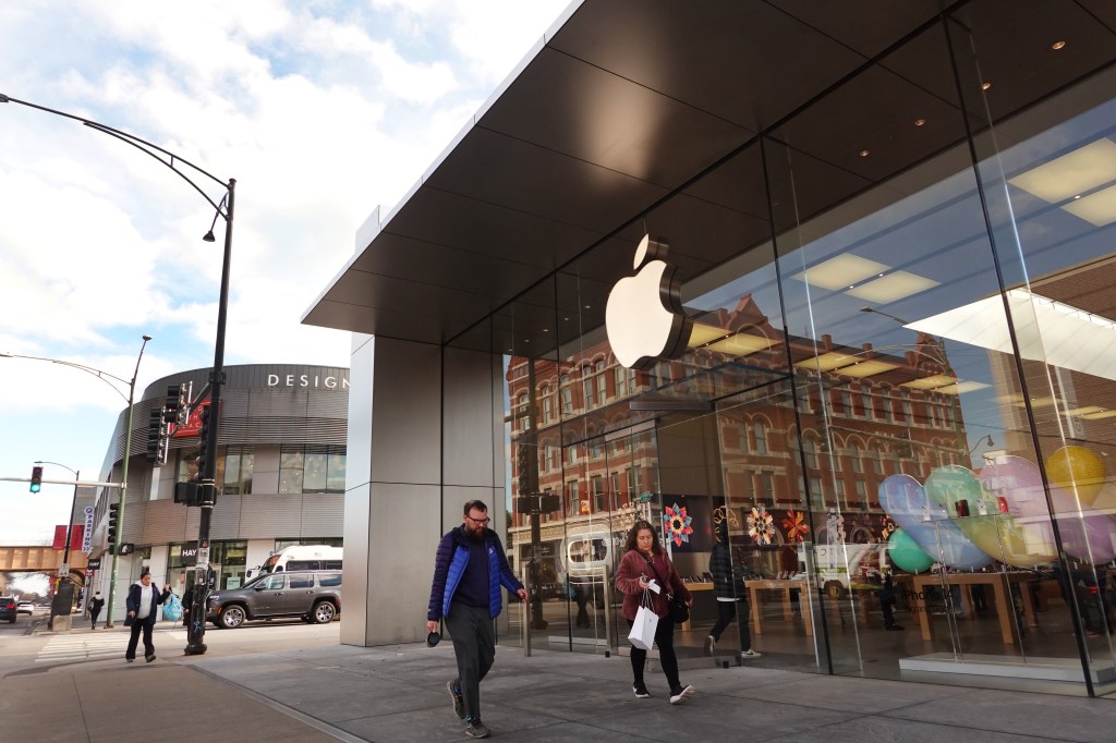 People who walk out of an Apple store